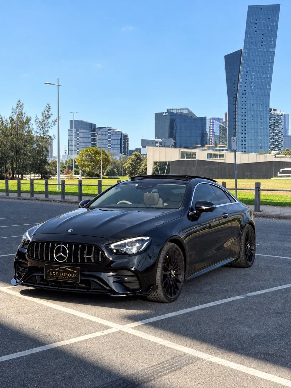 Black Mercedes E-Class coupé in Melbourne city parking