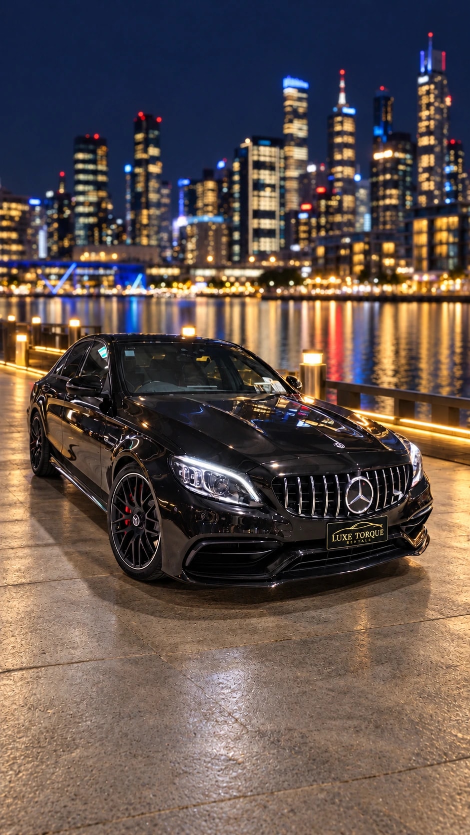 Black Mercedes-AMG C63 S sedan with city lights at night